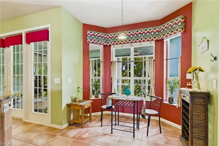 Sunny eat-in dining area overlooking the backyard.