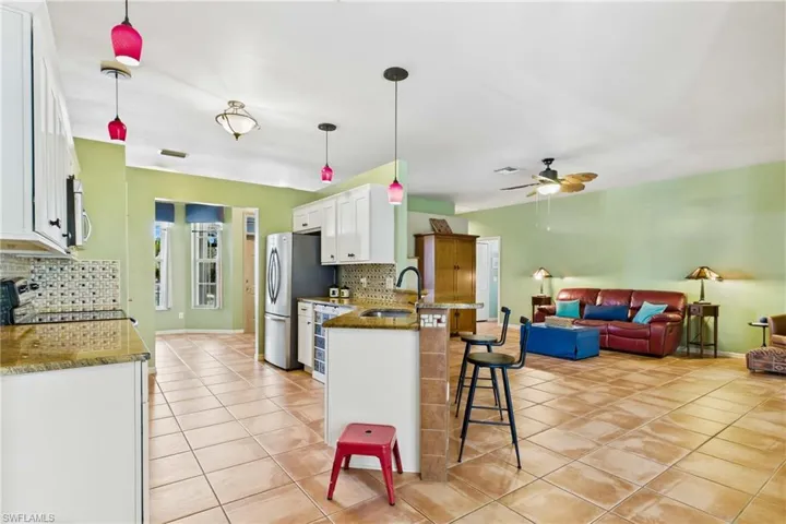 Another view of the spacious living room showcasing the open layout.