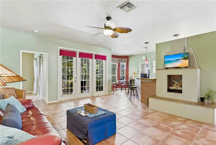 Comfortable gathering space featuring large windows and seamless flow.