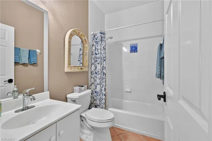 Guest Bath for both guest bedrooms - White vanity with an integrated sink and chrome faucet