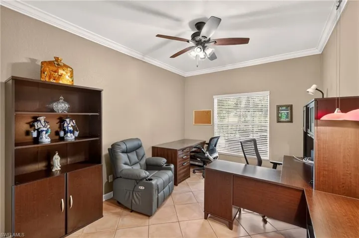 Bedroom 2 - Crown molding accenting the ceiling, a built-in ceiling fan with lighting, a window with blinds, and tile flooring