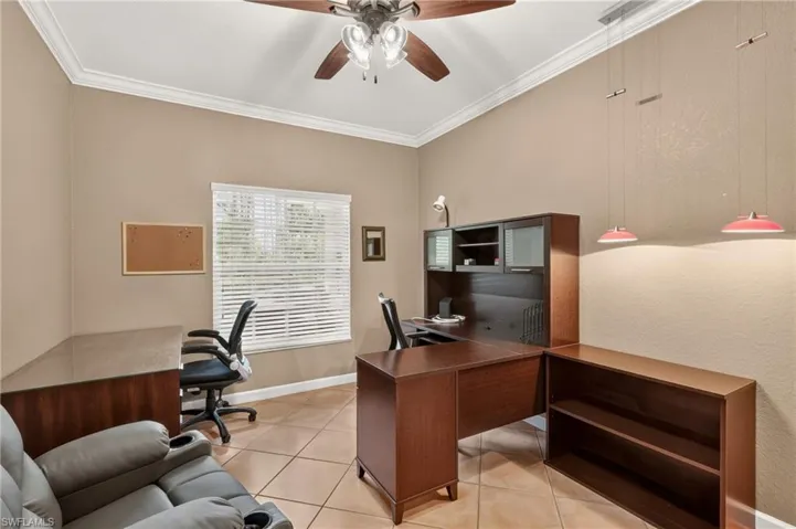 Bedroom 2 or office Vaulted ceiling with crown molding, ceiling fan, tile flooring, and window with blinds