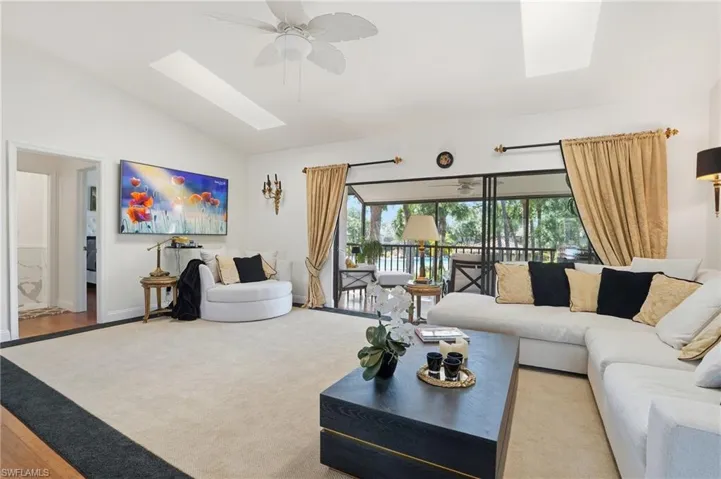 Light-filled, open-concept space with two skylights that flood the room with natural light and seamless access to outdoor living areas.