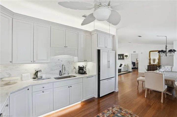Newly reimagined kitchen with custom cabinetry, marble and stone finishes with high-end appliances