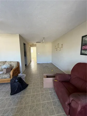 Living room featuring a textured ceiling