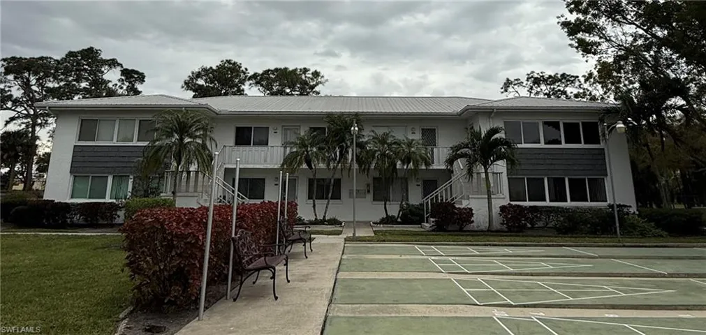 View of property's community featuring a lawn