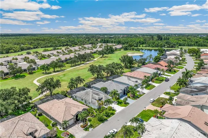 Birds eye view of property with a golf course view