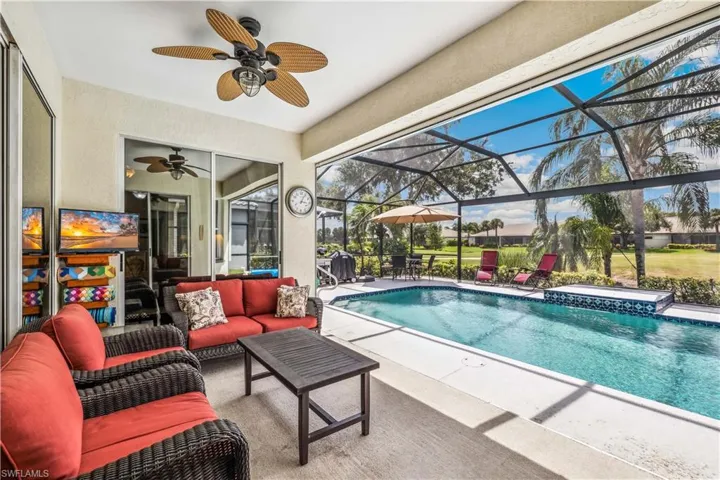 View of pool featuring a patio, ceiling fan and an outdoor hangout area - golf course view