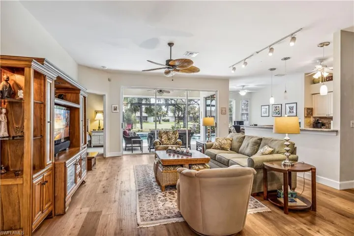 Living room from front door to lanai and pool