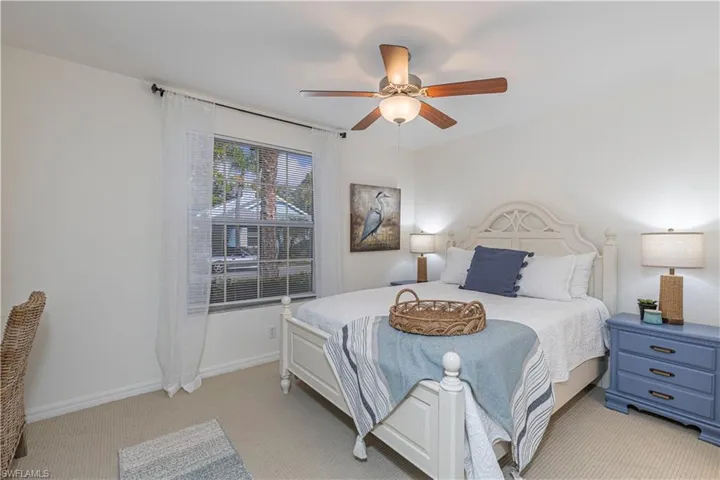 Cozy 2nd Bedroom with ceiling fan and new light carpet