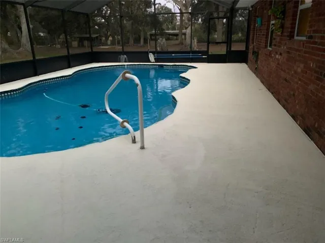 Swimming pool with screen and patio