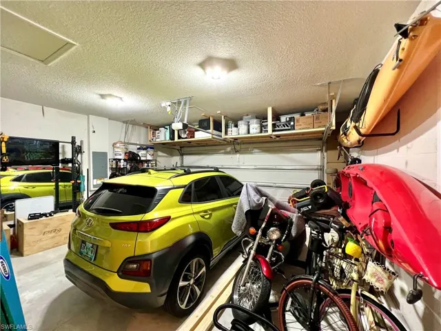 2 car Garage featuring storage loft ad attic access.