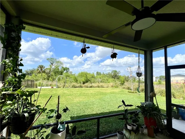 View of Preserve, large back yard from Screened Lanai featuring ceiling fan