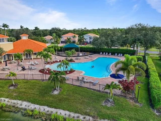 Community pool featuring a patio