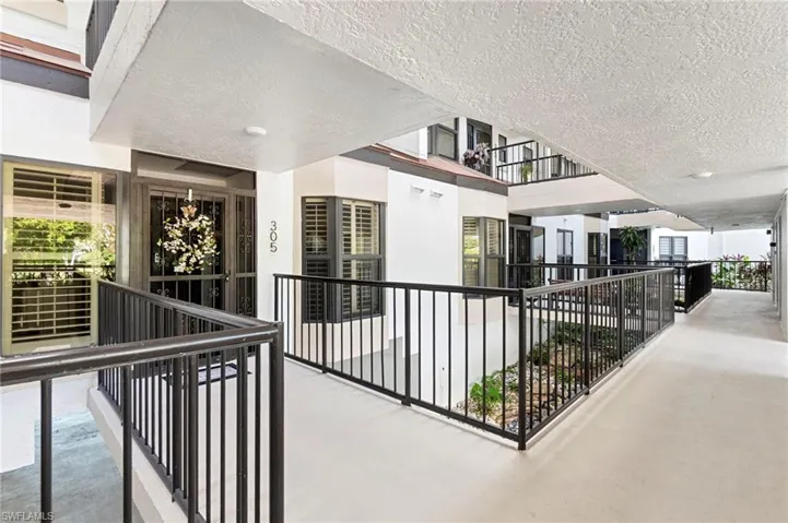 Hallway featuring an upstairs landing