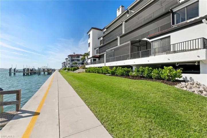Dock with a yard and a water view