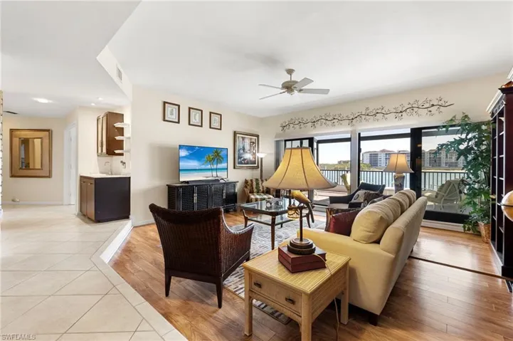 Living area featuring light wood finished floors and ceiling fan