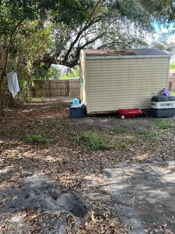 View of yard with a storage shed