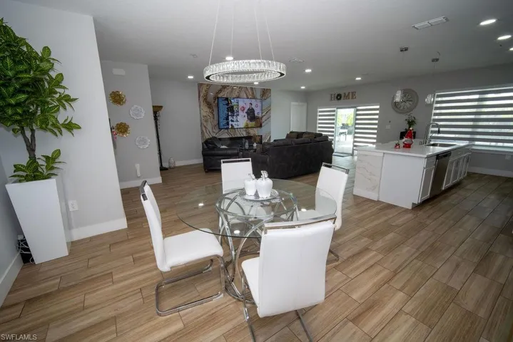 Dining area featuring wood finish floors and recessed lighting