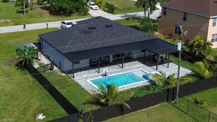 View of swimming pool featuring a patio and a fenced backyard