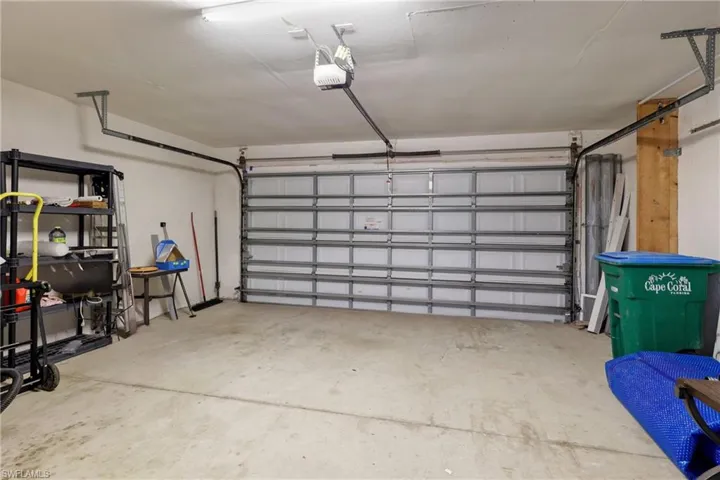 Garage featuring a garage door opener