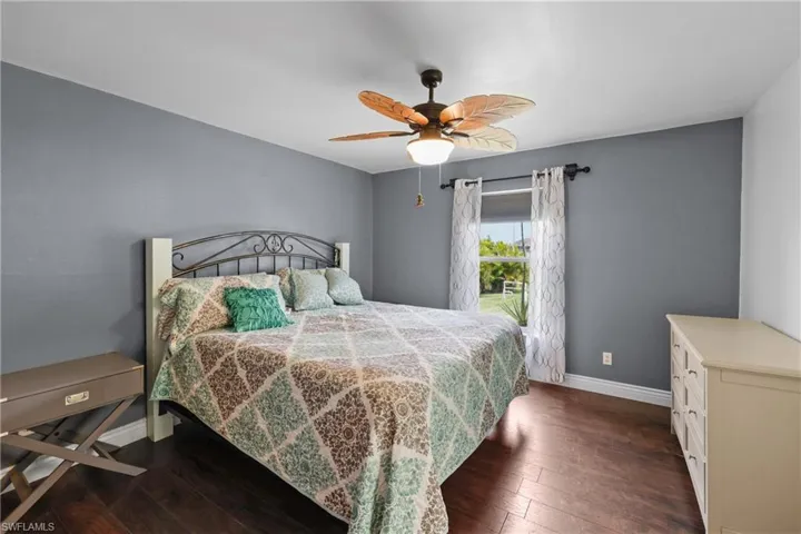 Bright master bedroom off kitchen with huge closet and ceiling fan