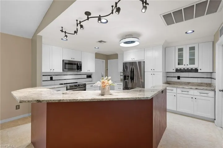 Tons of overhead light in your kitchen!