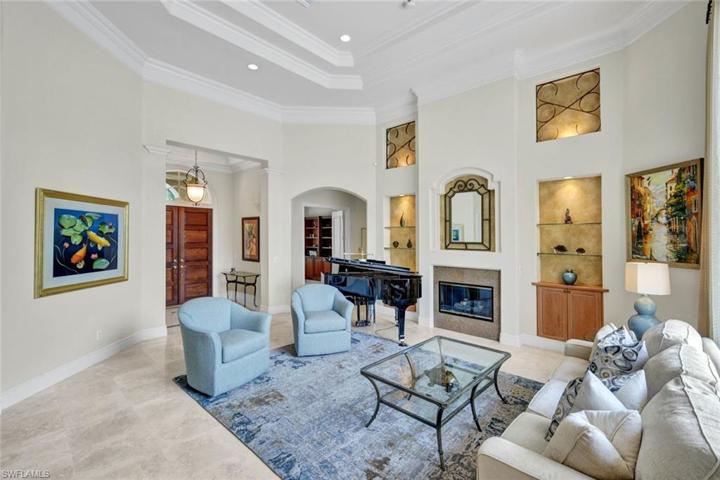 Architecturally Accented Ceilings, Moldings, Gas Fireplace, Wet Bar & Solid-Core 8' Doors