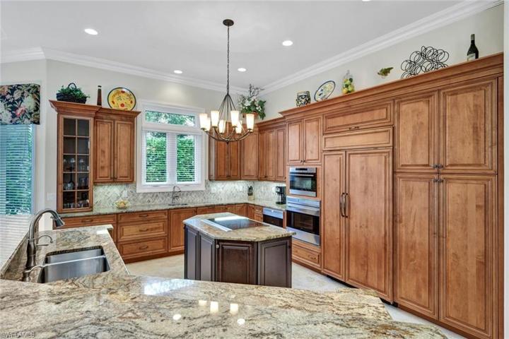 SubZero Refrigerator & 2 Dishwashers Are Wood Paneled.