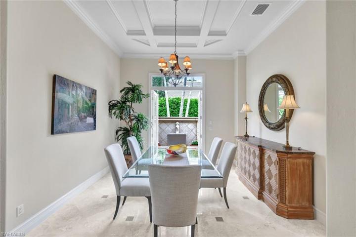 Elegant Dining Room w/ French Doors Opening to Quaint Courtyard