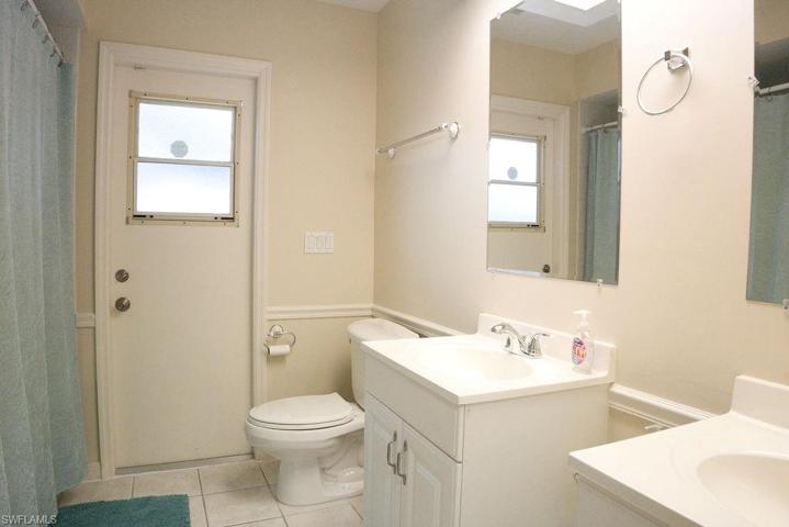 Guest bathroom with access to the pool area.