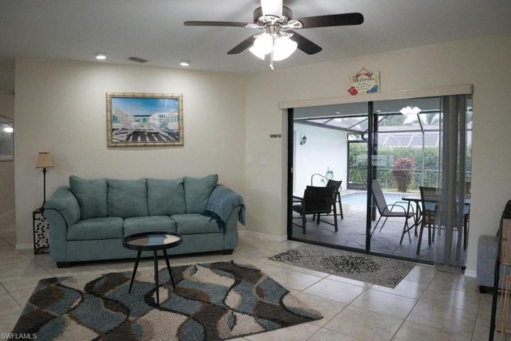 View of the formal living room to the pool area.