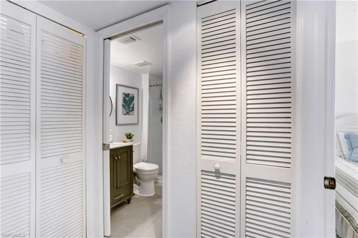 Stackable washer/dryer in closet to the left.