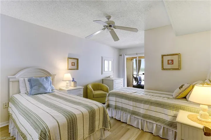 Guest bedroom also with sliders to balcony!