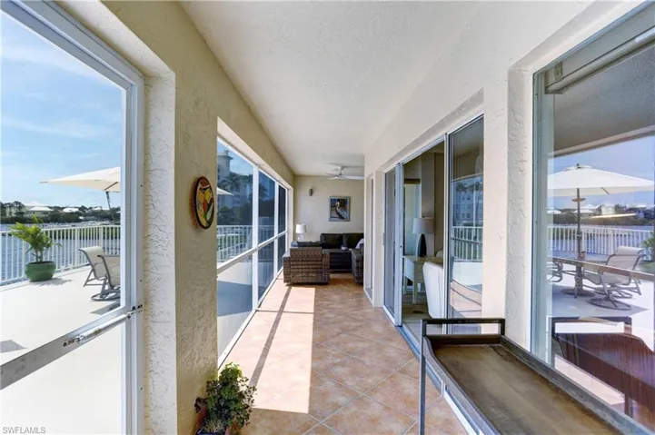 Covered screened balcony with sliders out of both bedrooms and Great Room!
