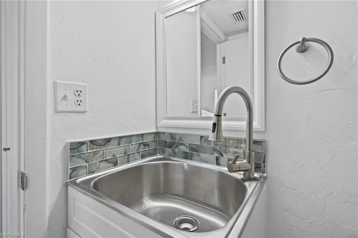 Room details featuring sink. First Floor Bathroom