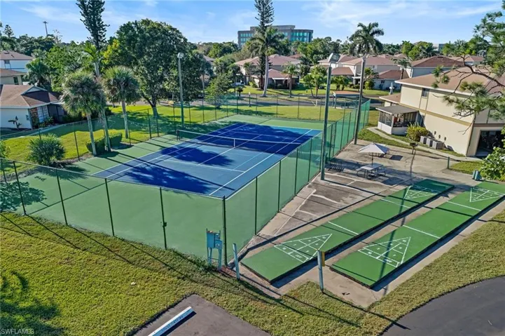 View of sport court with a yard. Pickleball
