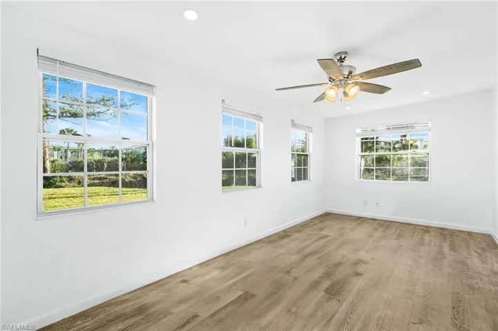 Empty room featuring LVP wood-style floors and ceiling fan. Extra Square footage
