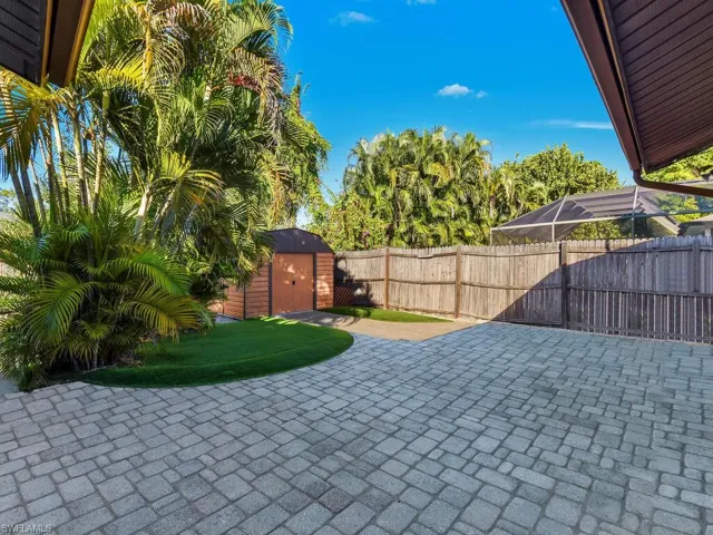 Paved lanai area with artificial turf