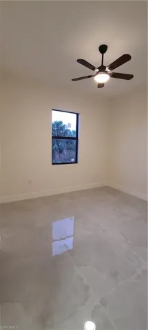 Spare room featuring ceiling fan
