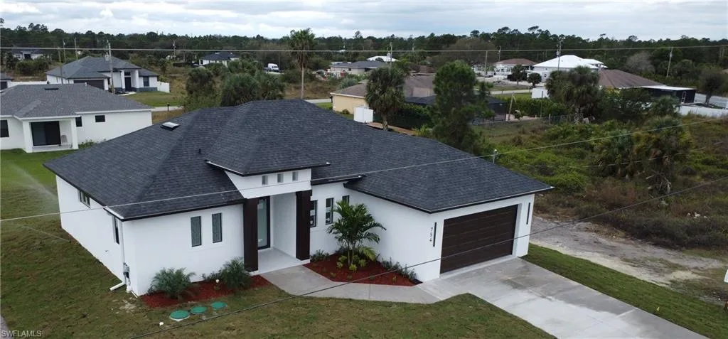 Birds eye view of property with a residential view
