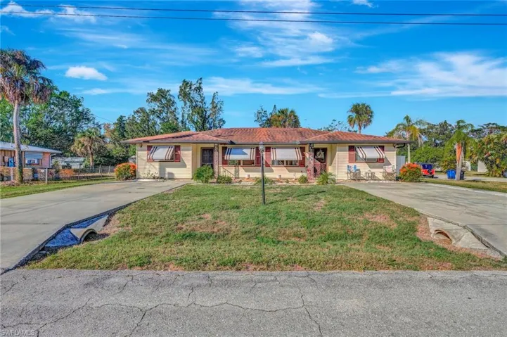 Single story home featuring a front yard