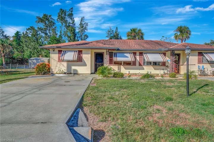 Ranch-style house with a front lawn