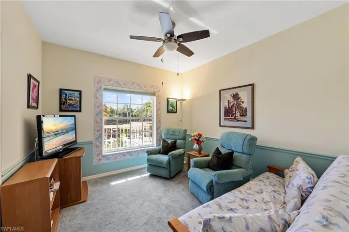 guest bedroom or den with closet