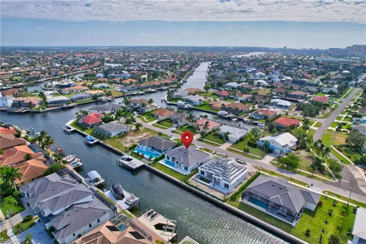 Canal-front property featuring a private boat dock and direct water access