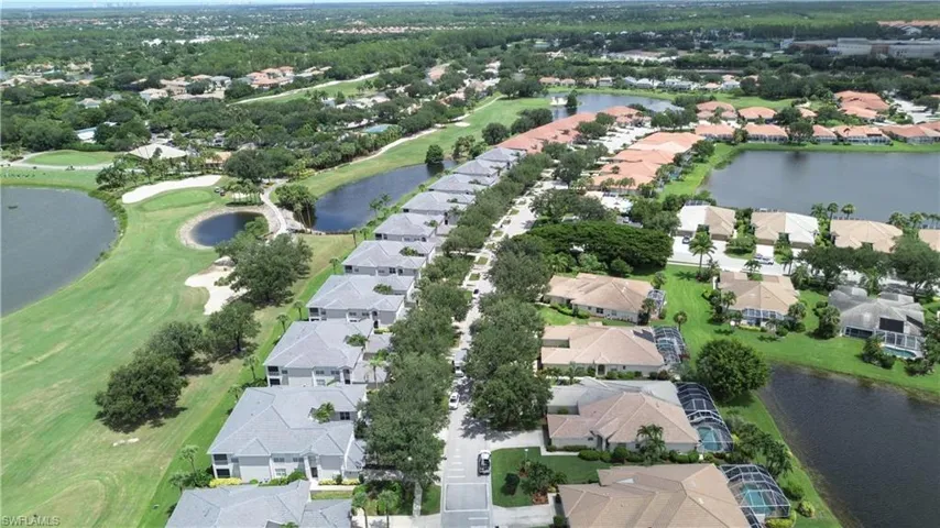 View of property location with nearby suburban area and a large body of water