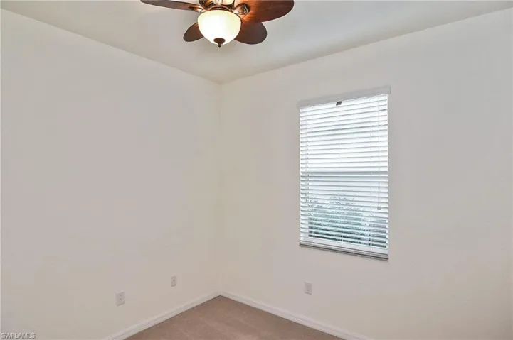 Unfurnished room with carpet flooring and ceiling fan