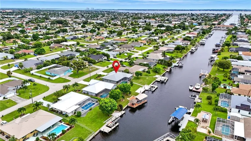 Aerial perspective of suburban area with a large body of water