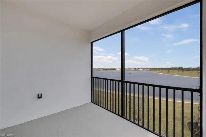 Enclosed Balcony featuring a water view