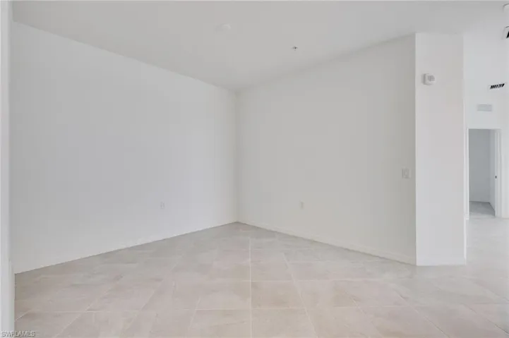 Unfurnished room featuring baseboards